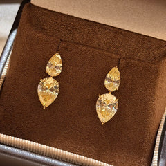 Goutte Solaire earrings with two graduated yellow pear-shaped stones